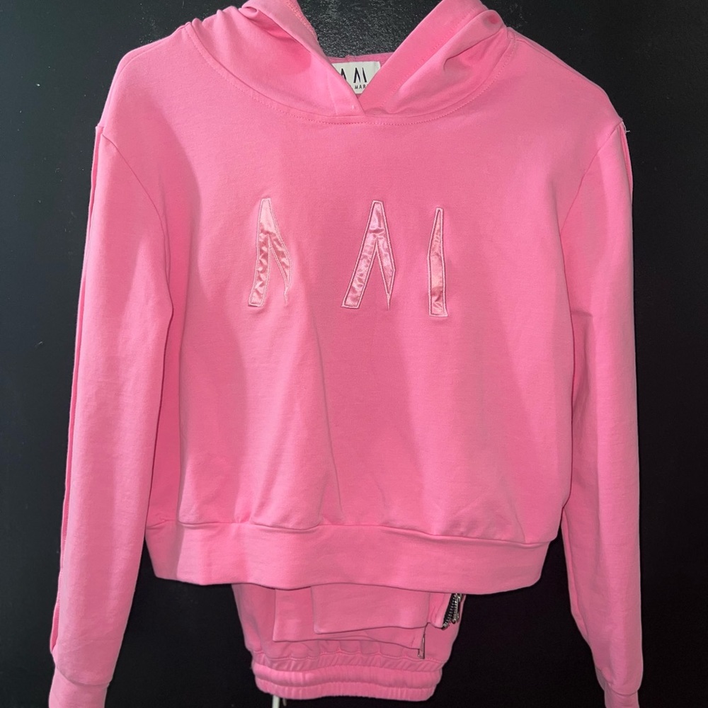 Pink cropped hoodie with matching bottoms.